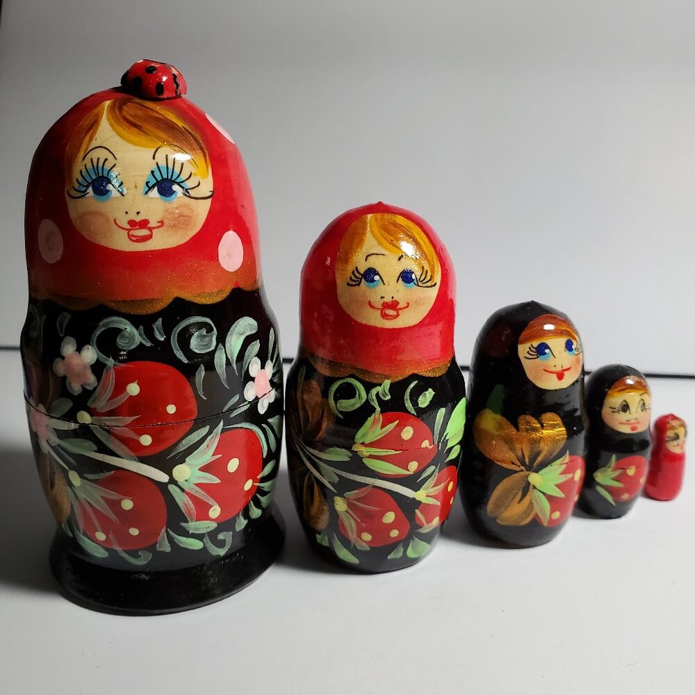 Matryoshkas Russian nesting dolls hand painted with Lady bug